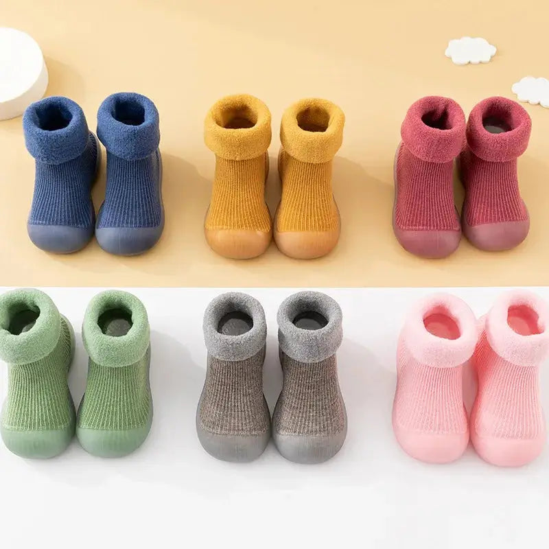 Colorful baby socks shoes in various shades