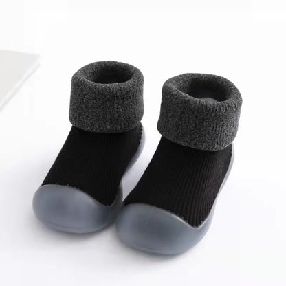 Black baby socks shoes with gray soles